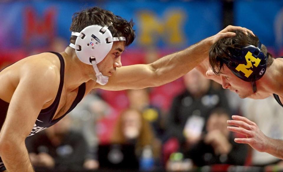 Penn State’s Aaron Nagao reaches for Michigan’s Dylan Ragusin in a 133 lb semifinal bout of the Big Ten Wresting Championships at the Xfinity Center at the University of Maryland on Saturday, March 9, 2024. Abby Drey/adrey@centredaily.com