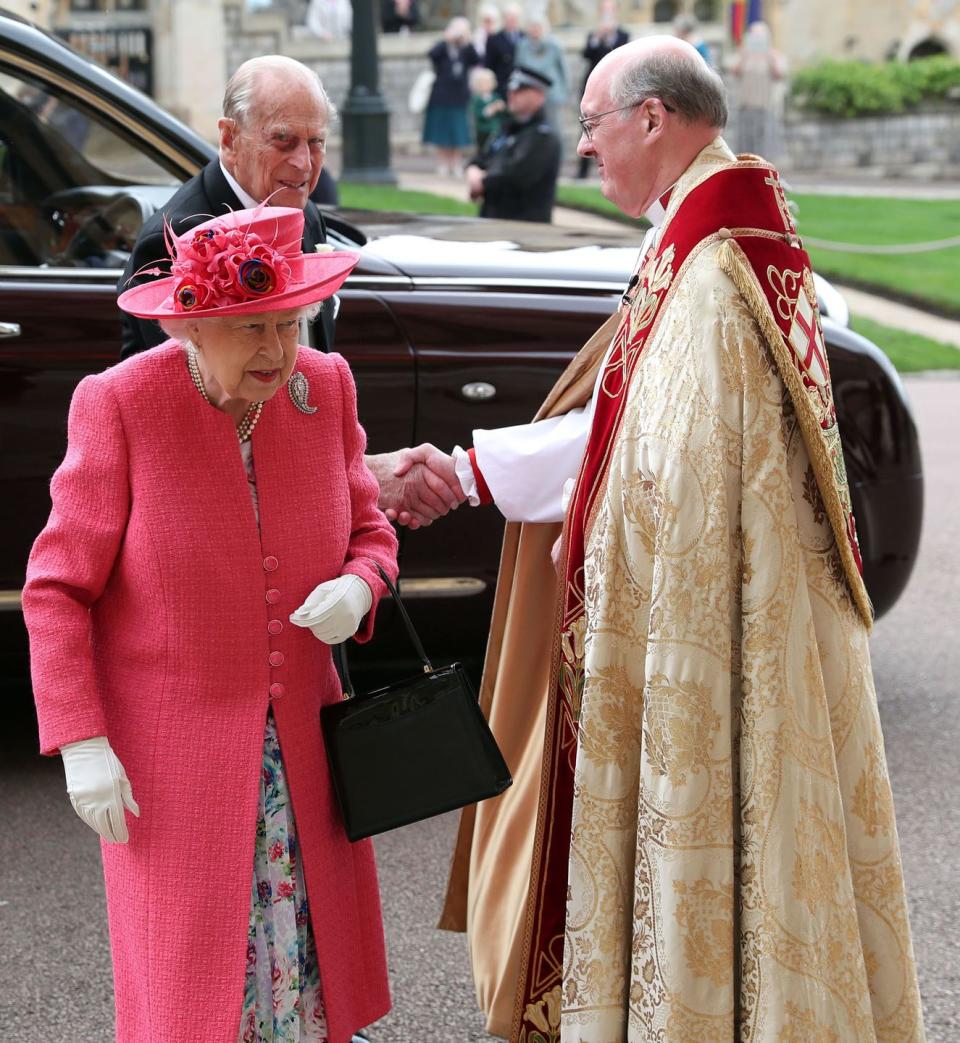 <p>The queen, dressed in <a href="https://www.harpersbazaar.com/celebrity/latest/a27509258/queen-elizabeth-lady-gabriella-windsor-royal-wedding/" rel="nofollow noopener" target="_blank" data-ylk="slk:bright pink;elm:context_link;itc:0;sec:content-canvas" class="link ">bright pink</a>, and Prince Philip step into the venue, greeting the officiant on the way in. </p>