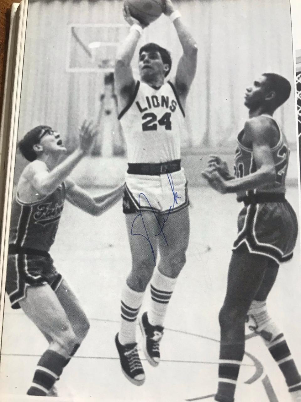 Nick Saban (center) plays basketball for Monongah High School in West Virginia in the late 1960s.