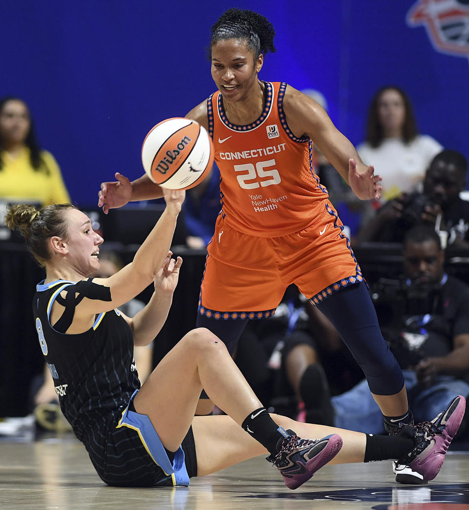 Chicago Sky's Alanna Smith (8) passes the ball past Connecticut Sun's Alyssa Thomas (25) during a WNBA basketball game, Sunday, May 25, 2023, in Uncasville, Conn. (Sarah Gordon/The Day via AP)