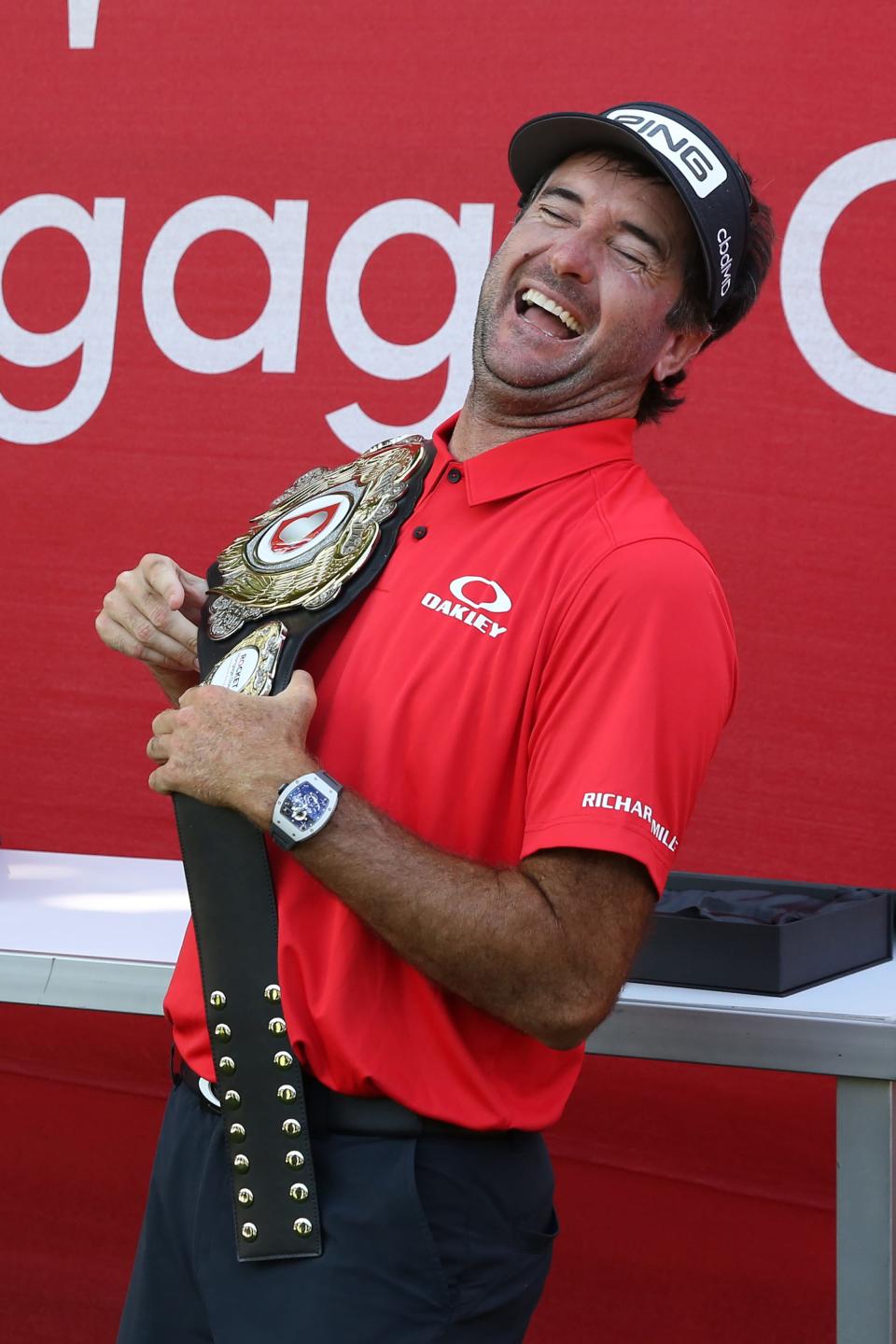 Jul 1, 2020; Detroit, Michigan, USA; Bubba Watson poses with the champions belt after being a winner of the Rocket Mortgage ClassicÕs ÒChanging the CourseÓ charity golf event, 12-time PGA TOUR winner and two-time Masters champion Bubba Watson and Harold Varner III versus former World No. 1 Jason Day and Wesley Bryan nine-hole exhibition at Detroit Golf Club. Mandatory Credit: Brian Spurlock-USA TODAY Sports