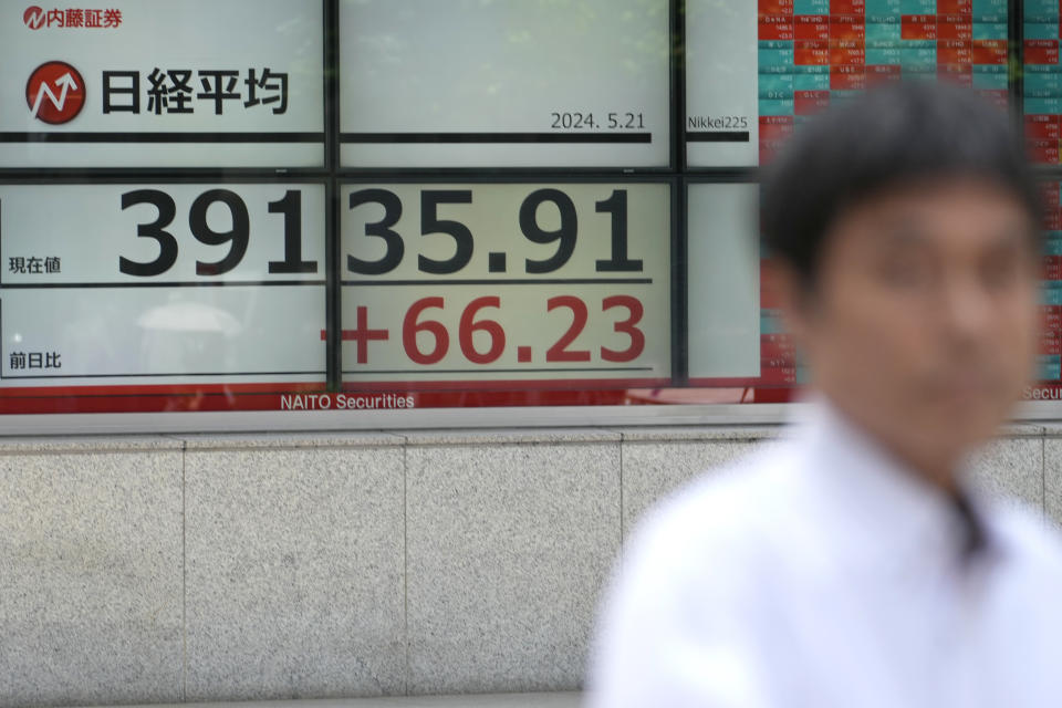 An electronic stock board showing Japan's Nikkei 225 index, is seen on the display of a securities firm Tuesday, May 21, 2024 in Tokyo. (AP Photo/Shuji Kajiyama)