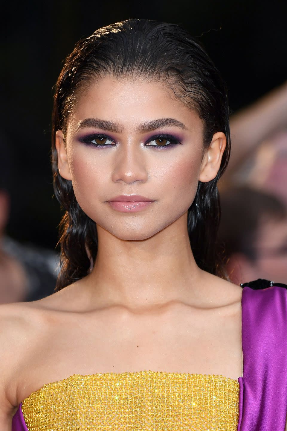 <p>Turns out that Zendaya isn't just a talented performer - she's excellent with hair and make-up too. The actress <a rel="nofollow noopener" href="https://www.instagram.com/zendaya/?hl=en" target="_blank" data-ylk="slk:revealed on Instagram;elm:context_link;itc:0;sec:content-canvas" class="link ">revealed on Instagram</a> that she created her latest red carpet look herself, giving us all hope that we can achieve it too. To recreate her purple smoky eye make-up, we'd recommend applying Mac's <a rel="noopener" href="https://fave.co/2PJPz1W" target="_blank" data-ylk="slk:Eye Shadow in Star 'N' Rockets;elm:context_link;itc:0;sec:content-canvas" class="link ">Eye Shadow in Star 'N' Rockets</a>, £14, with Nars' <a rel="noopener" href="https://fave.co/2PJ8xpj" target="_blank" data-ylk="slk:Blending Brush;elm:context_link;itc:0;sec:content-canvas" class="link ">Blending Brush</a>, £26, before using a creamy black eyeliner, such as Bobbi Brown's <a rel="noopener" href="https://fave.co/2Nrmueg" target="_blank" data-ylk="slk:Eye Pencil in Jet;elm:context_link;itc:0;sec:content-canvas" class="link ">Eye Pencil in Jet</a>, £19.50, on both your lash lines for definition. As for your hair, saturate it with L'Oreal Professionnel's <a rel="nofollow noopener" href="https://www.mankind.co.uk/l-oreal-professionnel-tecni-art-pli-shaper-190ml/10897276.html?affil=thgppc&utm_source=criteo&utm_medium=cpc&utm_campaign=DynamicRemarketingCriteo&switchcurrency=GBP&shippingcountry=GB" target="_blank" data-ylk="slk:Techni Art Pli;elm:context_link;itc:0;sec:content-canvas" class="link ">Techni Art Pli</a>, £11.50, from root to tip to achieve the all-important super-glossy finish.</p>