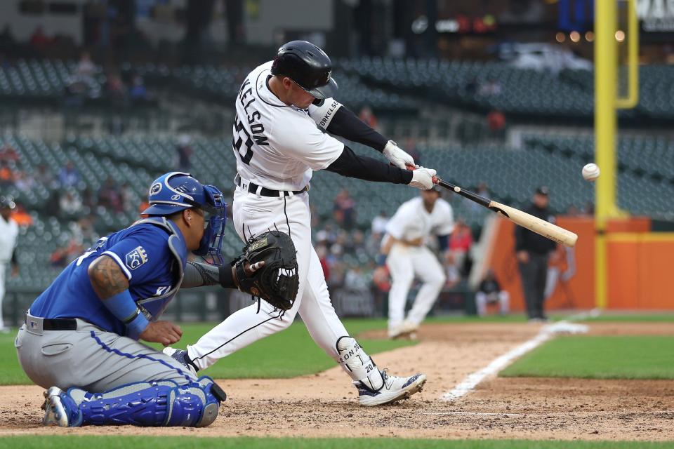 Spencer Torkelson of the Detroit Tigers hits a three-run home run in front of Salvador Perez of the Kansas City Royals during the seventh inning at Comerica Park on September 28, 2023 in Detroit, Michigan.