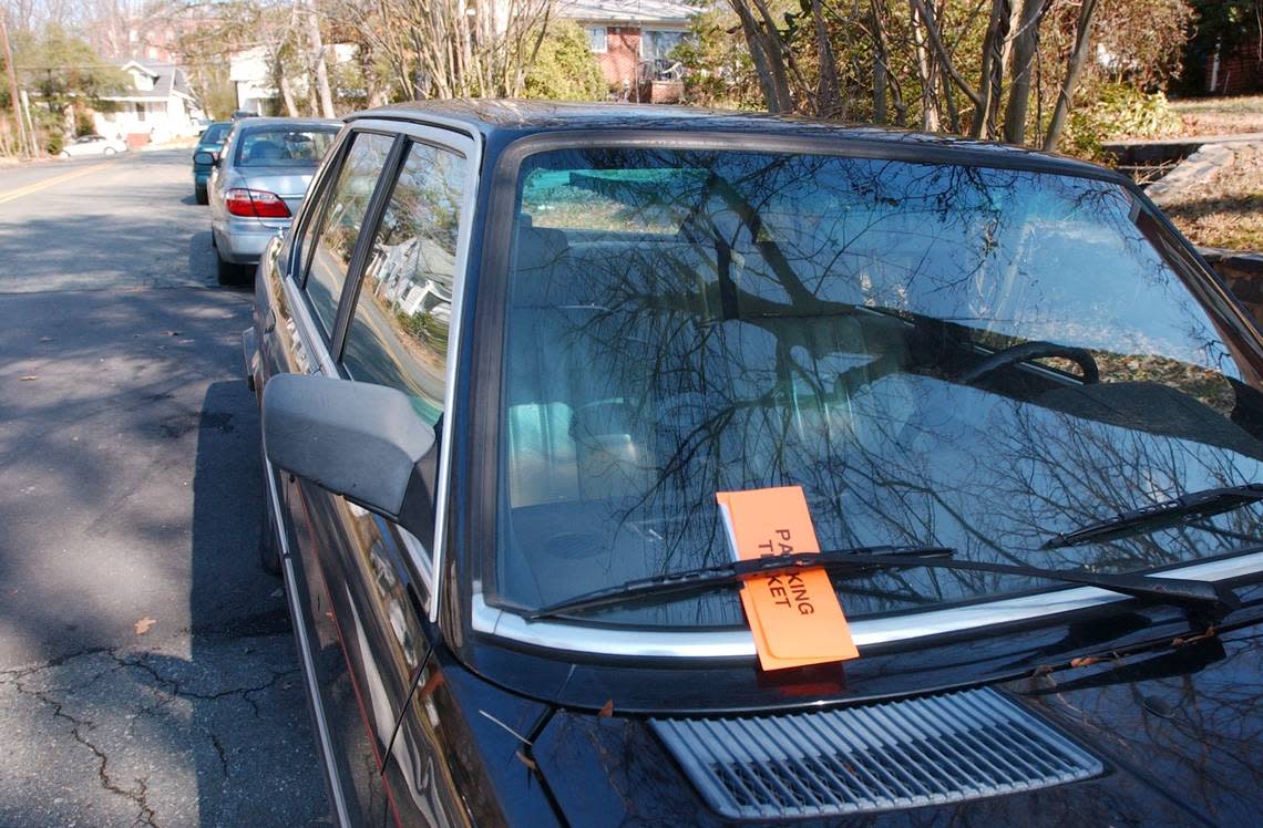 A parking ticket graces a vehicle at a residential side street in North Carolina. File/The Herald-Sun