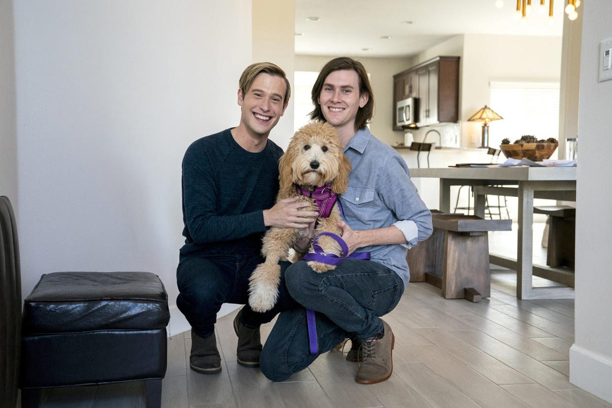 Henry with his partner, Clint Godwin, and their dog, Nanci. (Tyler Golden / Netflix)