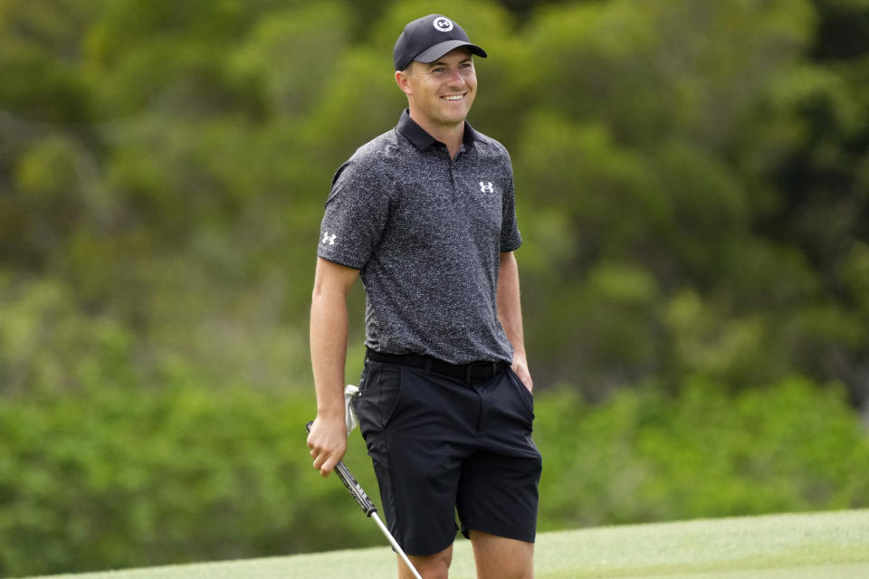 Jordan Spieth smiles towards the fans on the 18th green during the Tournament of Champions pro-am golf event, Wednesday, Jan. 4, 2023, at Kapalua Plantation Course in Kapalua, Hawaii. (AP Photo/Matt York)