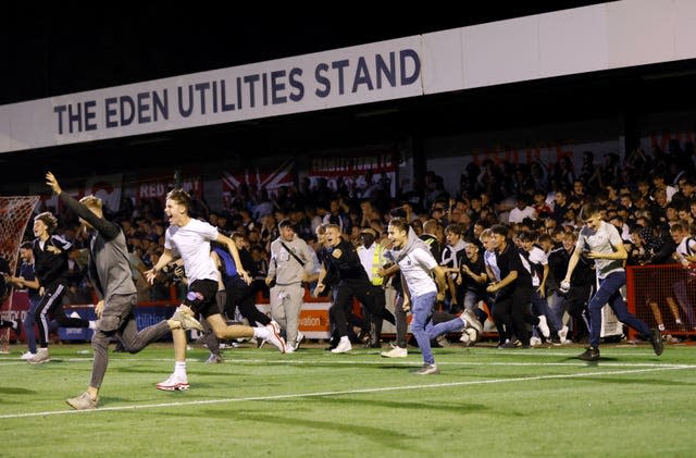 Crawley fans ignored warnings to stay off the Broadfield Stadium pitch