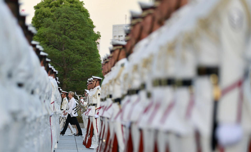 <p>Italian Defense Minister Roberta Pinotti walks as she reviews an honor guard with her Japanese counterpart Tomomi Inada, partially seen behind Pinotti, at the Defense Ministry in Tokyo, Monday, May 22, 2017. (AP Photo/Shizuo Kambayashi) </p>