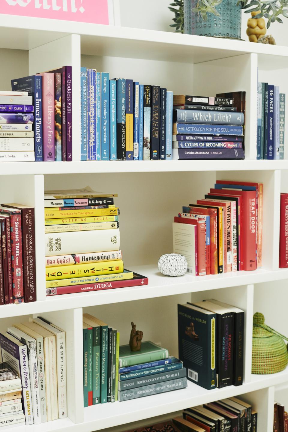 The colorful bookshelves that line Nicholas' L.A. home.