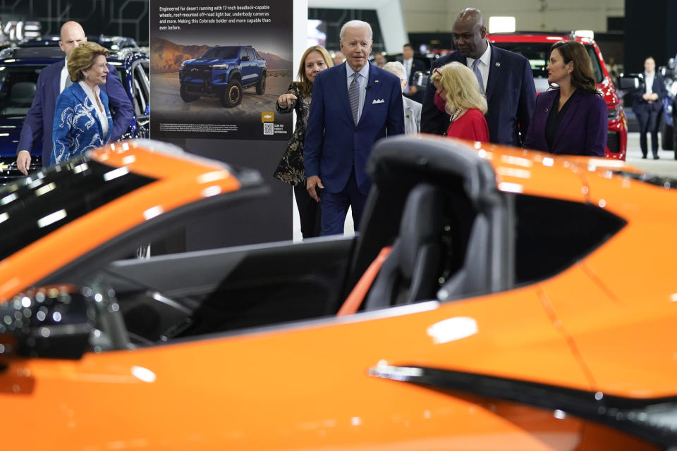 President Joe Biden listens during a tour at the Detroit Auto Show, Wednesday, Sept. 14, 2022, in Detroit. From left, Sen. Debbie Stabenow, D-Mich., Mary Barra, CEO of General Motors, Biden, Rep. Debbie Dingell, D-Mich., Ray Curry, President of the United Auto Workers, and Michigan Gov. Gretchen Whitmer. (AP Photo/Evan Vucci)