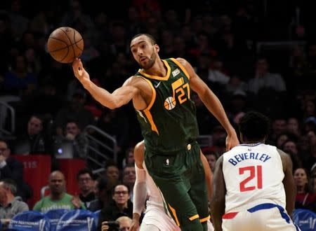 Jan 16, 2019; Los Angeles, CA, USA; Utah Jazz center Rudy Gobert (27) looks to control a loose ball against LA Clippers guard Patrick Beverley (21) during the first half at Staples Center. Mandatory Credit: Kirby Lee-USA TODAY Sports