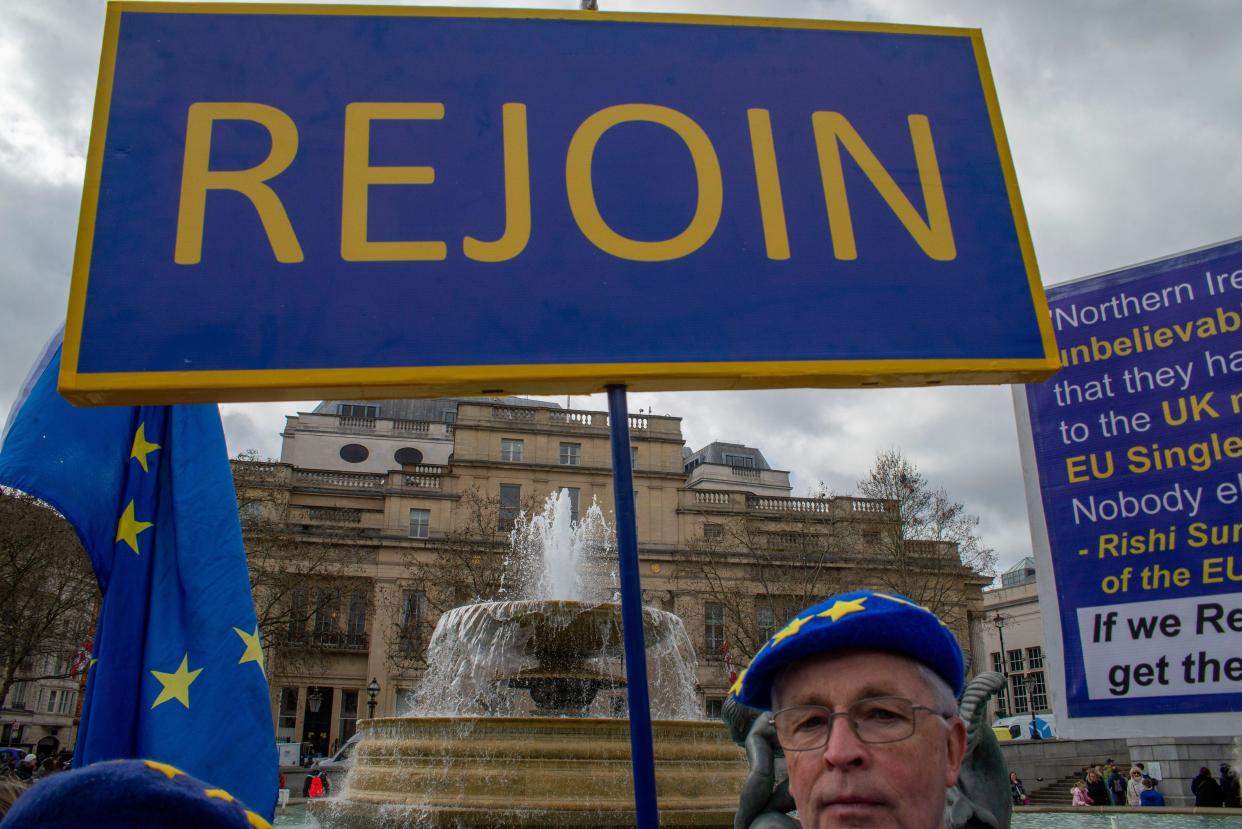 London - 25 March 2023 - Banner and flags as part of the campaign to rejoin the EU at Trafalgar Square during the London icons 'tour' of sites. More i
