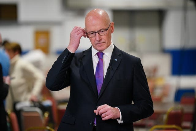 John Swinney, in suit and tie, looking disappointed