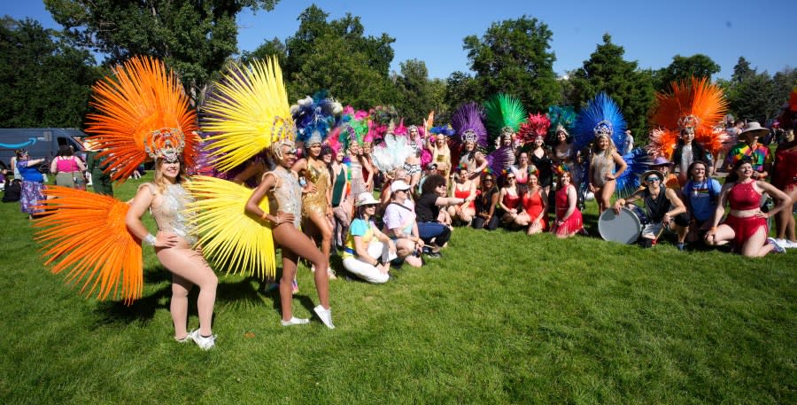 Participants take part in the Pride parade through the streets of downtown Sunday, June 25, 2023, in Denver. (AP Photo/David Zalubowski)