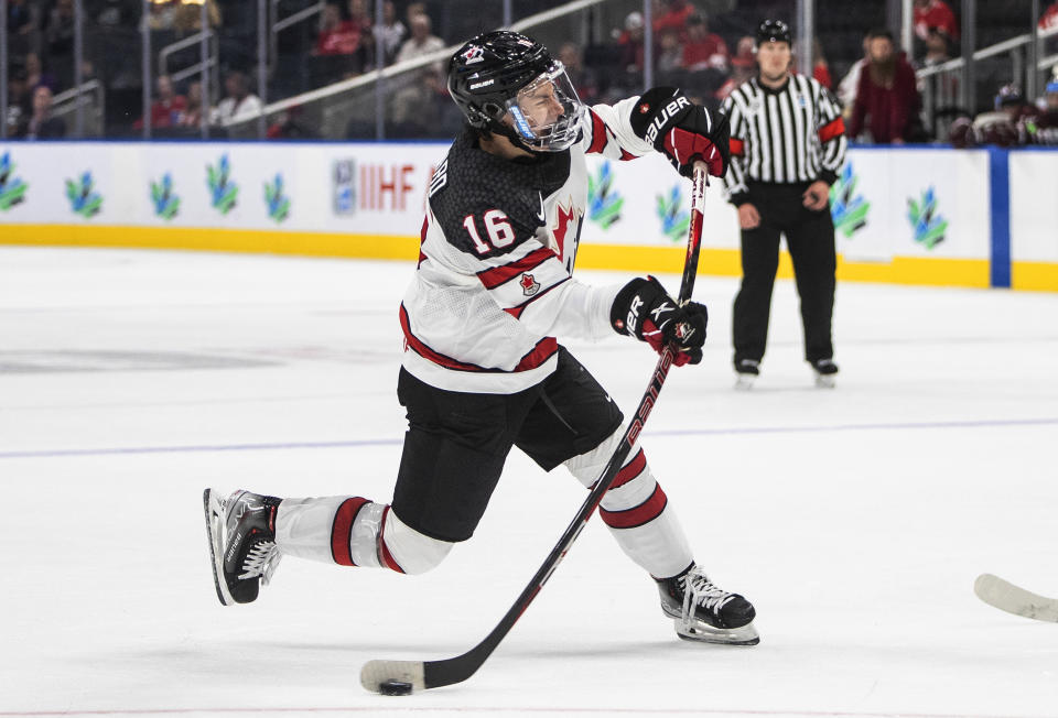 FILE - Canada's Connor Bedard (16) shoots against Latvia during the second period of an IIHF junior world hockey championships game Wednesday, Aug. 10, 2022, in Edmonton, Alberta. Bedard, 17, who is highly anticipated to be selected first in the NHL draft by the Chicago Blackhawks, joins his fellow draft-eligible prospects in participating at the NHL combine. (Jason Franson/The Canadian Press, File)