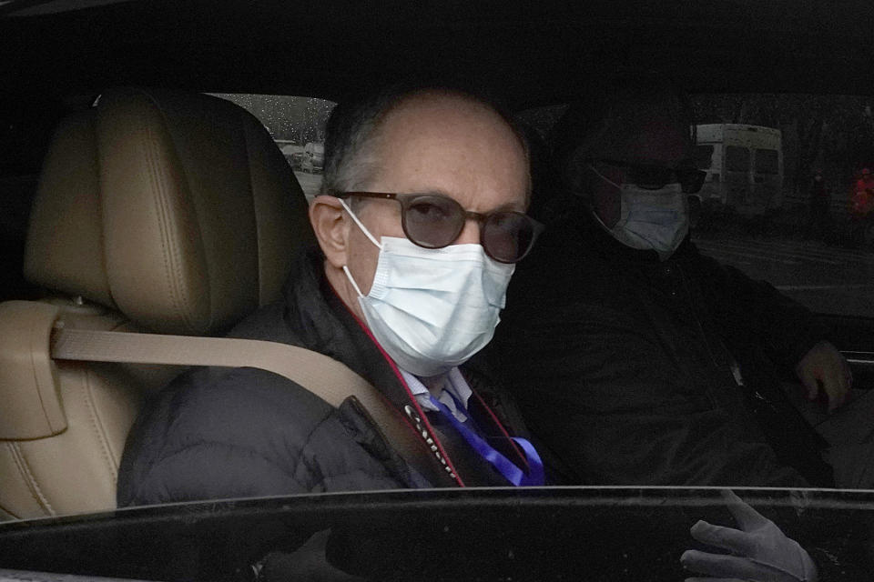 Peter Ben Embarek of the World Health Organization team leaves in a convoy from the Baishazhou wholesale market on the third day of field visit in Wuhan in central China's Hubei province on Sunday, Jan. 31, 2021. (AP Photo/Ng Han Guan)