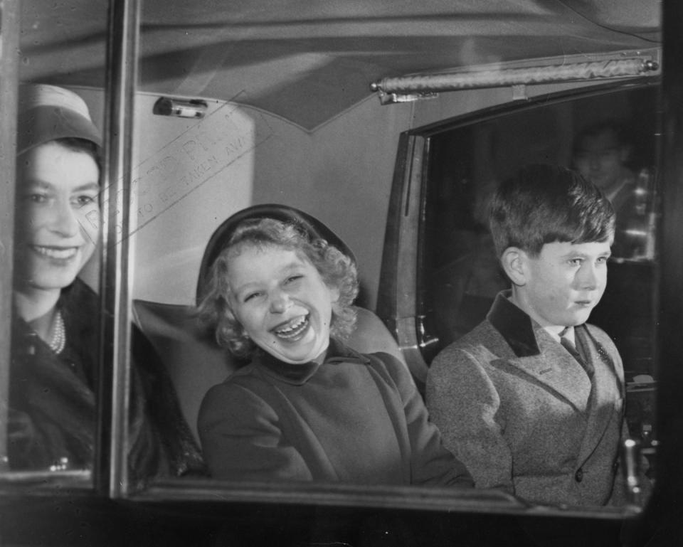 <p>The Queen shares a laugh with her daughter, Princess Anne, and son, Prince Charles, in the car, while traveling to Sandringham for Christmas.</p>