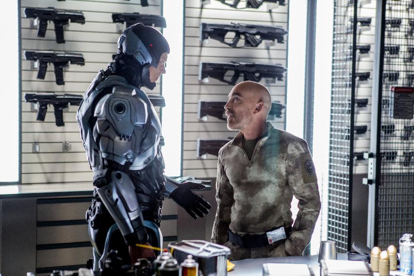 This image released by Columbia Pictures shows Joel Kinnaman, left, and Jackie Earle Haley in a scene from "RoboCop." (AP Photo/Columbia Pictures - Sony, Kerry Hayes)