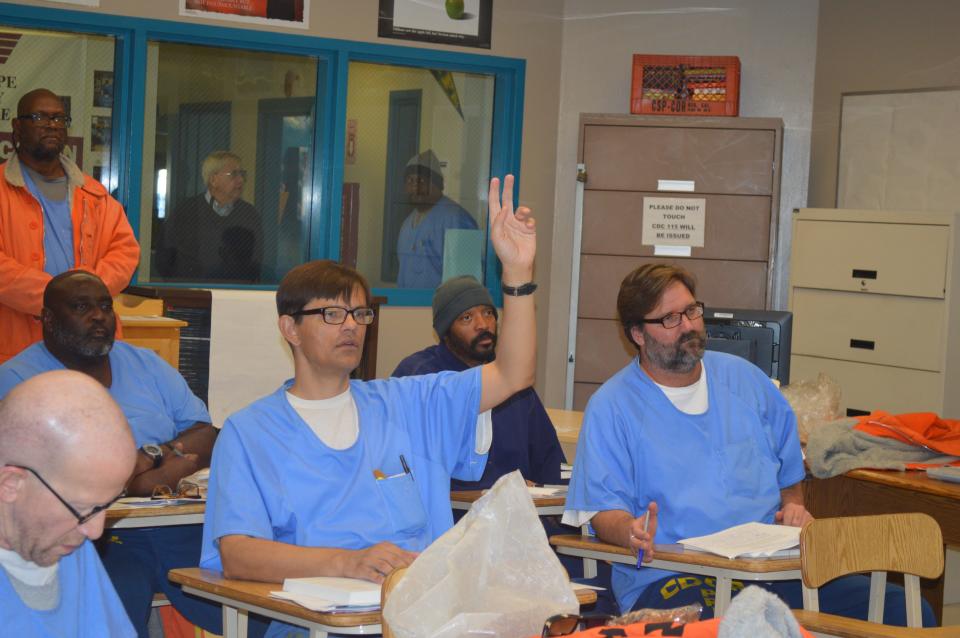 Prisoners learn the basics of how to conduct accurate polls in Cal State LA’s communication research class at Lancaster prison.