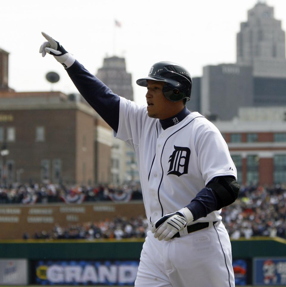 Miguel Cabrera points to the crowd after his grand slam for a 7-0 Tigers lead in the fourth inning against the Rangers in Detroit on Friday, April 10, 2009.