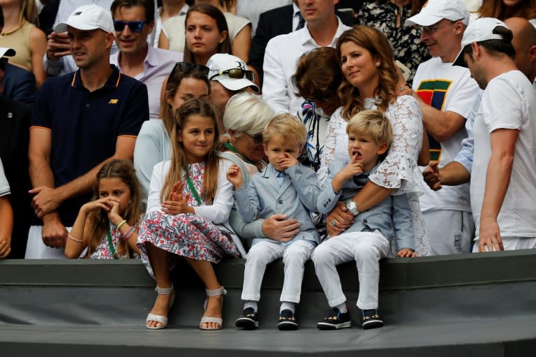 Mirka Federer, wife of Switzerland's Roger Federer, stands with her children Charlene Riva, Myla Rose, Lenny and Leo