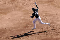 Chicago White Sox's Tim Anderson points to the right field bleachers where he hit his grand slam off of Cleveland Indians starting pitcher Triston McKenzie during the second inning of a baseball game Saturday, May 1, 2021, in Chicago. (AP Photo/Charles Rex Arbogast)