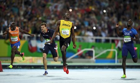 2016 Rio Olympics - Athletics - Final - Men's 200m Final - Olympic Stadium - Rio de Janeiro, Brazil - 18/08/2016. Usain Bolt (JAM) of Jamaica wins the race. REUTERS/Dylan Martinez