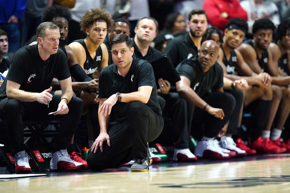 Cincinnati Bearcats head coach Wes Miller observes play in the second half of the 91st Crosstown Shootout basketball game between the Cincinnati Bearcats and the Xavier Musketeers, Saturday, Dec. 9, 2023, at Cintas Center in Cincinnati. The Xavier Musketeers won, 84-79.