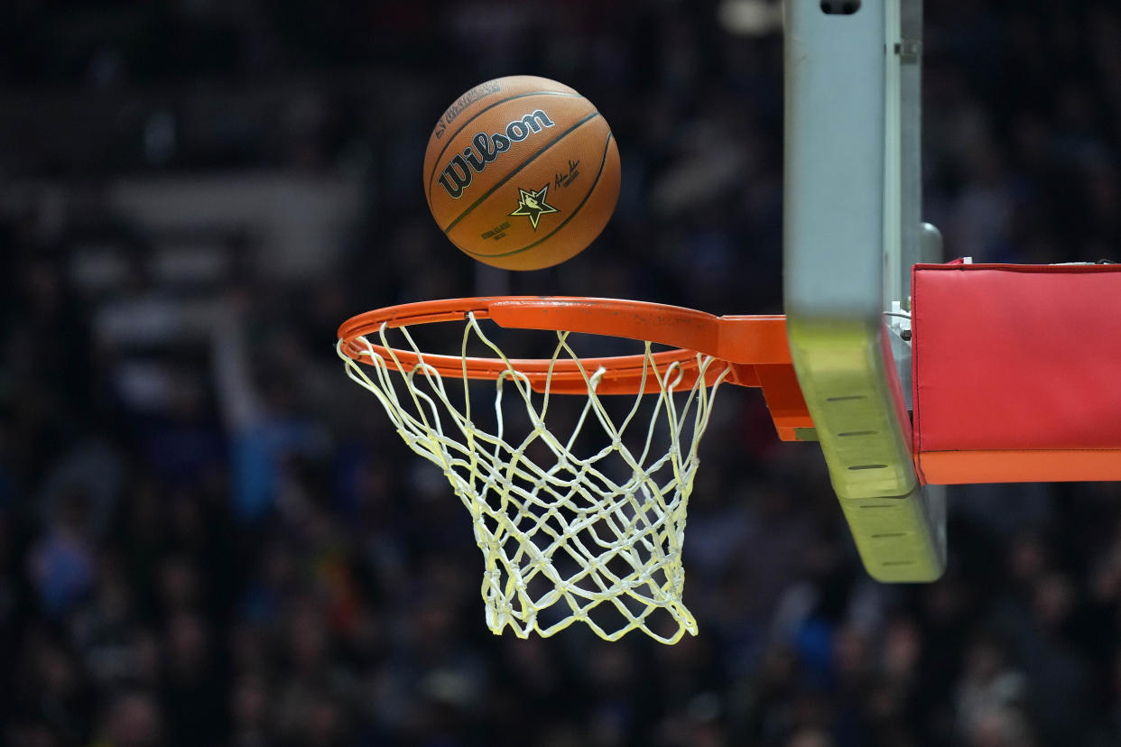 Feb 18, 2023; Salt Lake City, UT, USA; A Wilson official NBA All-Star Game logo basketball swishes throught the net at Huntsman Center. Mandatory Credit: Kirby Lee-USA TODAY Sports