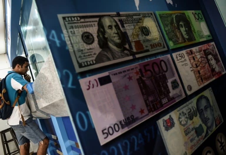 Malaysia's ringgit and Indonesia's rupiah lead an emerging market rally against the dollar while Asian equities also push higher after minutes from the Fed's policy meeting suggest it could keep borrowing costs at record lows into next year