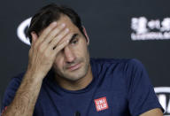 Switzerland's Roger Federer answers questions at a press conference following his fourth round loss to Greece's Stefanos Tsitsipas at the Australian Open tennis championships in Melbourne, Australia, Sunday, Jan. 20, 2019. (AP Photo/Aaron Favila)