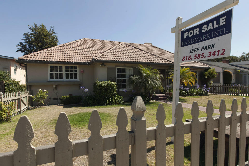 In this photo taken Tuesday, July 17, 2012, a single family home is for sale in the Hollywood area of Los Angeles. Americans bought more homes in July than in June and prices rose, the latest evidence that the housing market is slowly recovering. Sales of previously occupied homes rose to 4.47 million in July, a 2.3 percent increase from the previous month, the National Association of Realtors said Wednesday. (AP Photo/Damian Dovarganes)