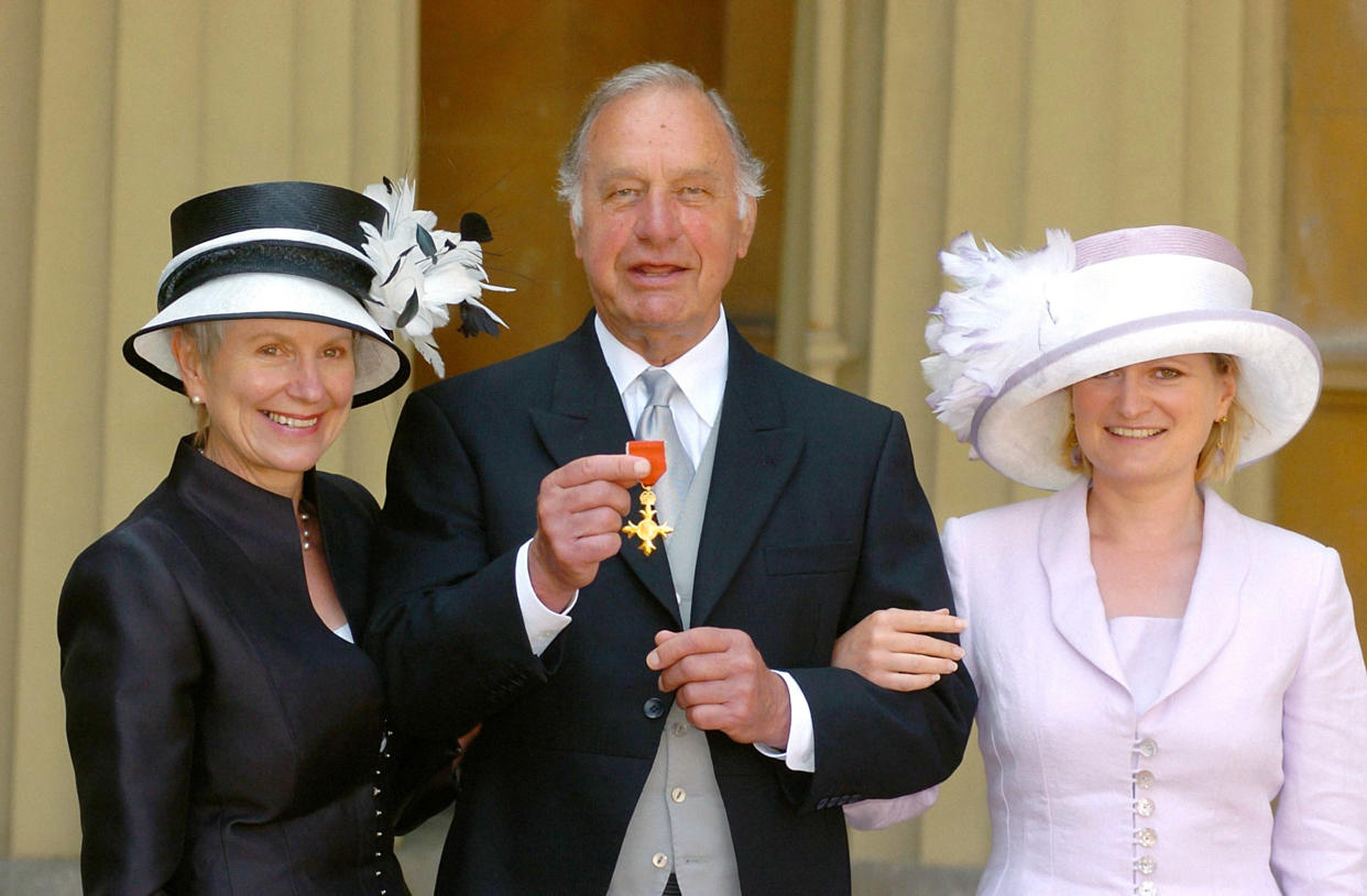 <p>Geoffrey Palmer collecting his OBE</p> (PA)
