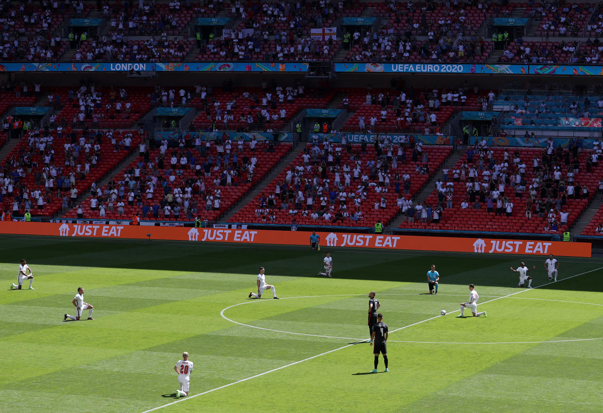 LONDON, ENGLAND - JUNE 13: A general view inside the stadium as players of England takes a knee in support of the Black Lives Matter movement prior to the UEFA Euro 2020 Championship Group D match between England and Croatia at Wembley Stadium on June 13, 2021 in London, England. (Photo by Catherine Ivill/Getty Images)