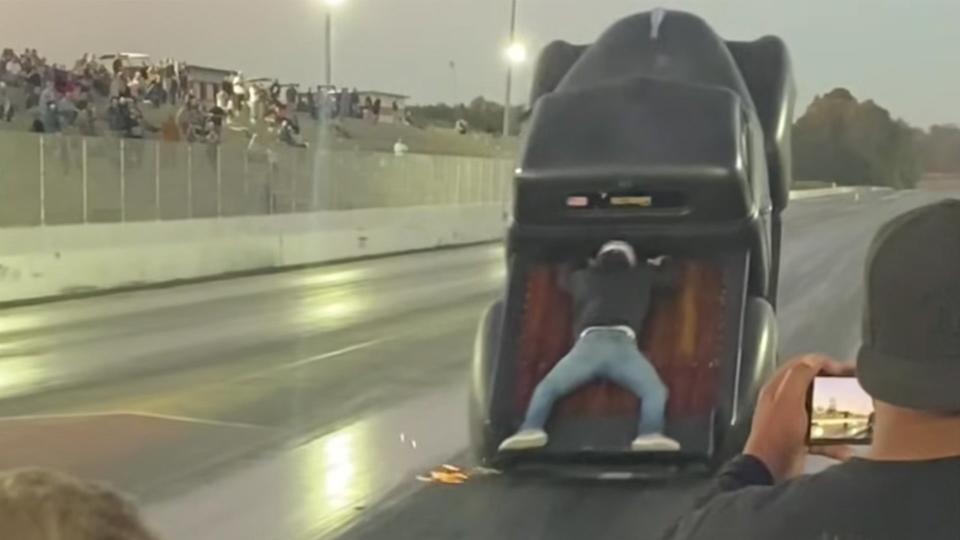 This Guy Rode In the Bed of a Drag Truck During a Pass. It Turned Into a Mess photo