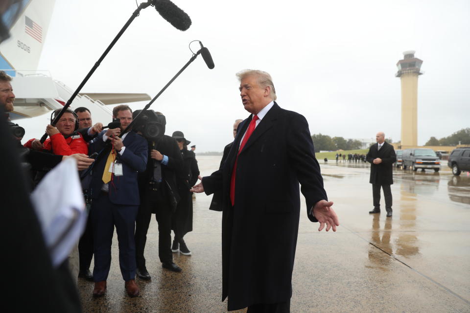 President Donald Trump speaks to the media at Air Force One at Andrews Air Force Base, Saturday, Oct. 27, 2018, to before travelling to Indianapolis to speak at the 91st Annual Future Farmers of America Convention and Expo. (AP Photo/Andrew Harnik)