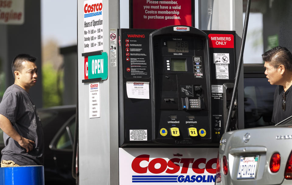 Motorists refuel at the Costco gas station in Burbank, Calif., Friday, Oct. 5, 2012. Californians woke up to a shock Friday as overnight gasoline prices jumped by as much as 20 cents a gallon in some areas, ending a week of soaring costs that saw some stations close and others charge record prices. (AP Photo/Damian Dovarganes)