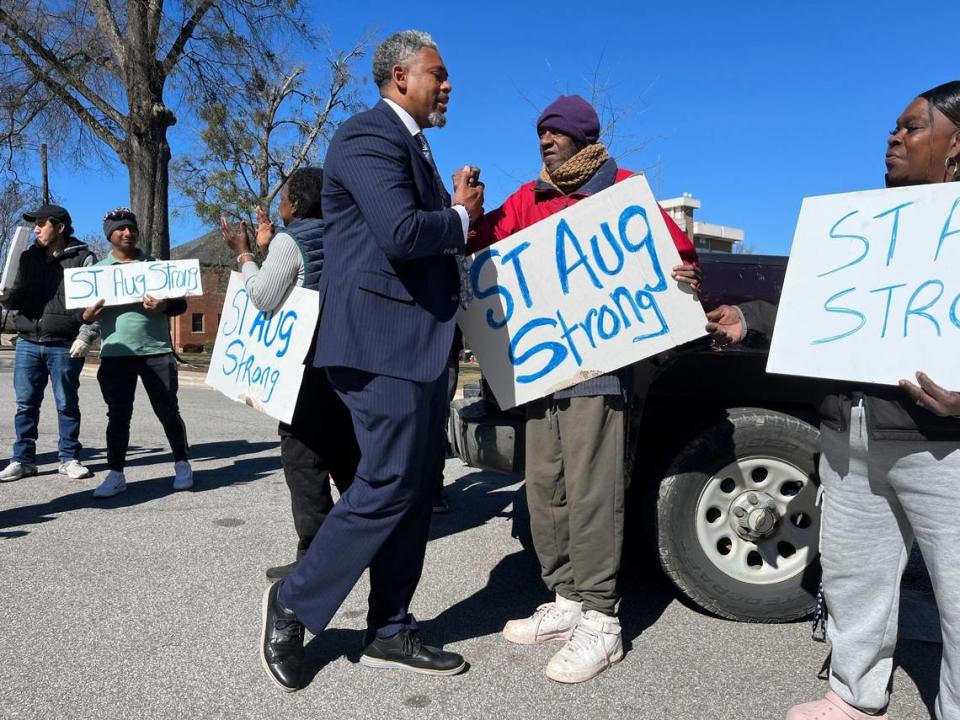 Marcus Burgess, interim president of St. Augustine’s University, greets supporters after a press conference concerning the university’s financial challenges, Monday, Feb. 19, 2024.