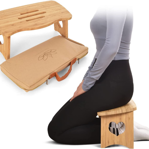 woman sitting on light wood meditation bench against white background