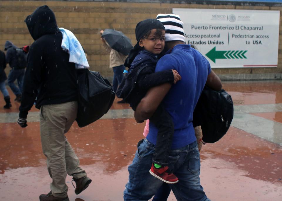 Central American migrants seeking asylum in the United States at the U.S.-Mexico border in Tijuana, Mexico, on May 7. (Photo: Guillermo Arias/AFP/Getty Images)