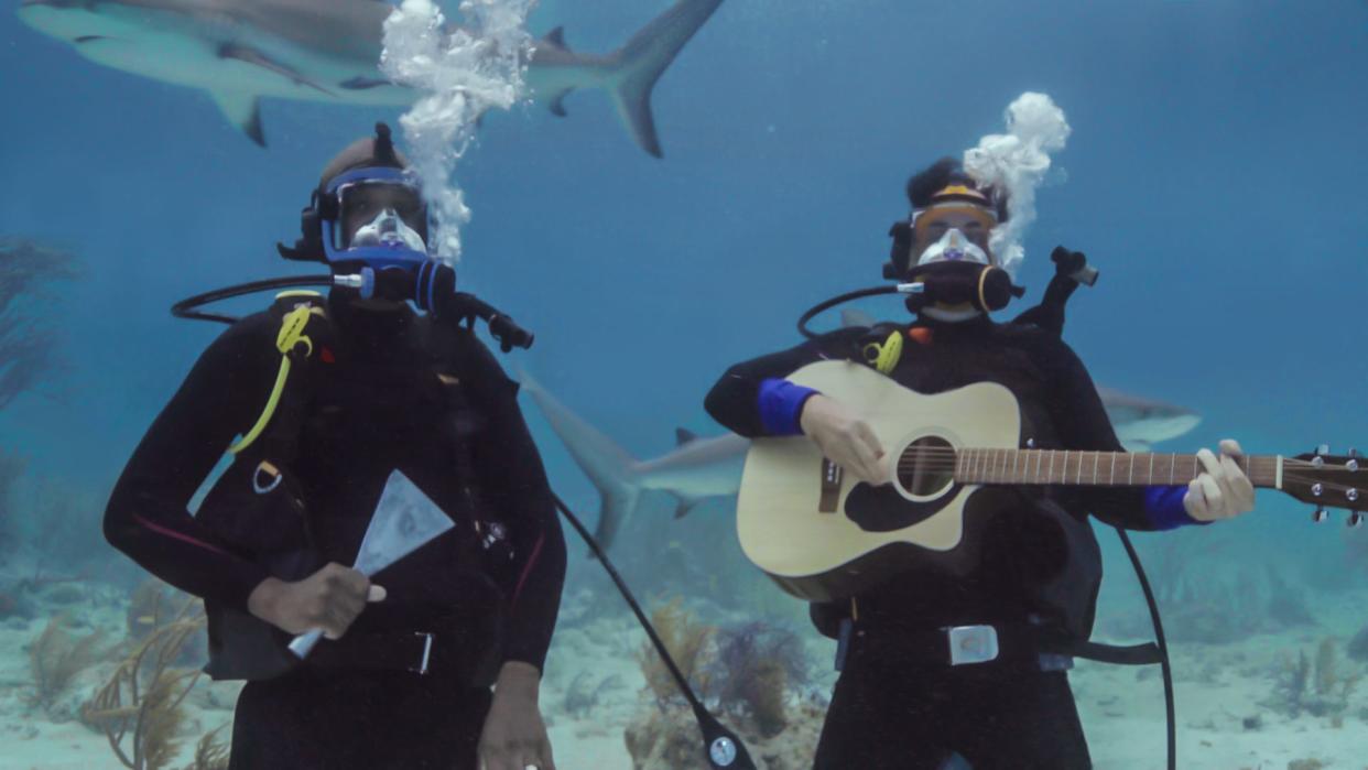 Brad Paisley gets weird with a guitar, some sharks and comedian JB Smoove in their "Shark Week" special, airing Tuesday, July 13 at 9 p.m. on Discovery.