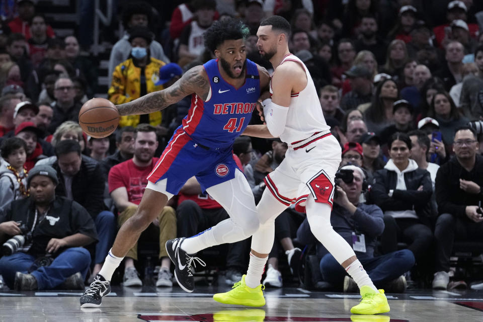 Detroit Pistons forward Saddiq Bey, left, drives against Chicago Bulls guard Zach LaVine during the first half of an NBA basketball game in Chicago, Friday, Dec. 30, 2022. (AP Photo/Nam Y. Huh)
