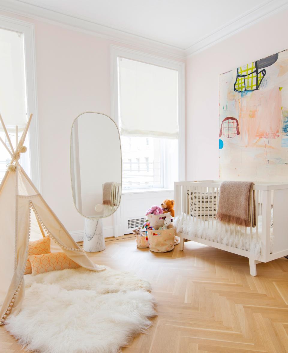 This little girls’ room is decorated with a sculptural pedestal mirror from Matter, a buoyant painting by Gary Komarin, and an ultra-plush rug from Nanimarquina.