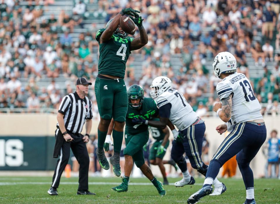 Michigan State linebacker Jacoby Windmon (4) blocks a pass from Akron quarterback Jeff Undercuffler Jr. (13) during the second half at Spartan Stadium in East Lansing on Saturday, Sept. 10, 2022.