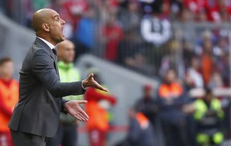 Football Soccer - Bayern Munich v Borussia Moenchengladbach - German Bundesliga - Allianz-Arena, Munich, Germany 30/04/16 - Bayern Munich's coach Pep Guardiola reacts during the match. REUTERS/Kai Pfaffenbach