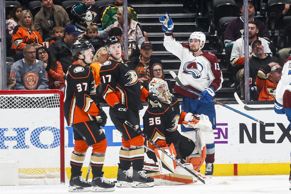 Colorado Avalanche forward Valeri Nichushkin, right, celebrates after scoring against Anaheim Ducks goalie John Gibson, second from right, during the second period of an NHL hockey game in Anaheim, Calif., Monday, March 27, 2023. (AP Photo/Ringo H.W. Chiu)