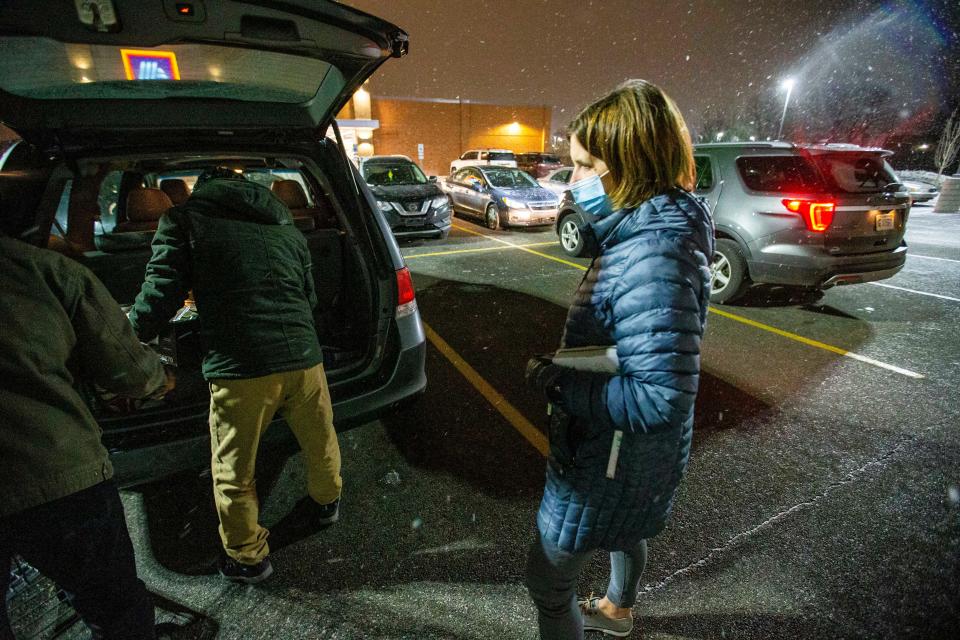 Jessica Fuller, a local volunteer with Riverside Church in South Bend, works with Afghan refugees while shopping Wednesday, Jan. 19, 2022, at Aldi in Mishawaka.