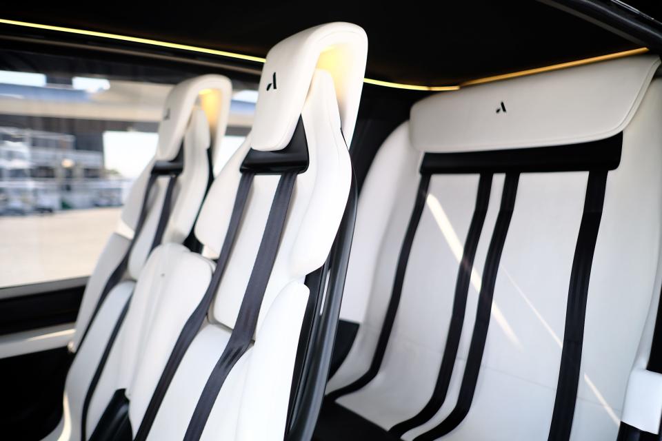 Four white passenger seats in an Autoflight Prosperity I