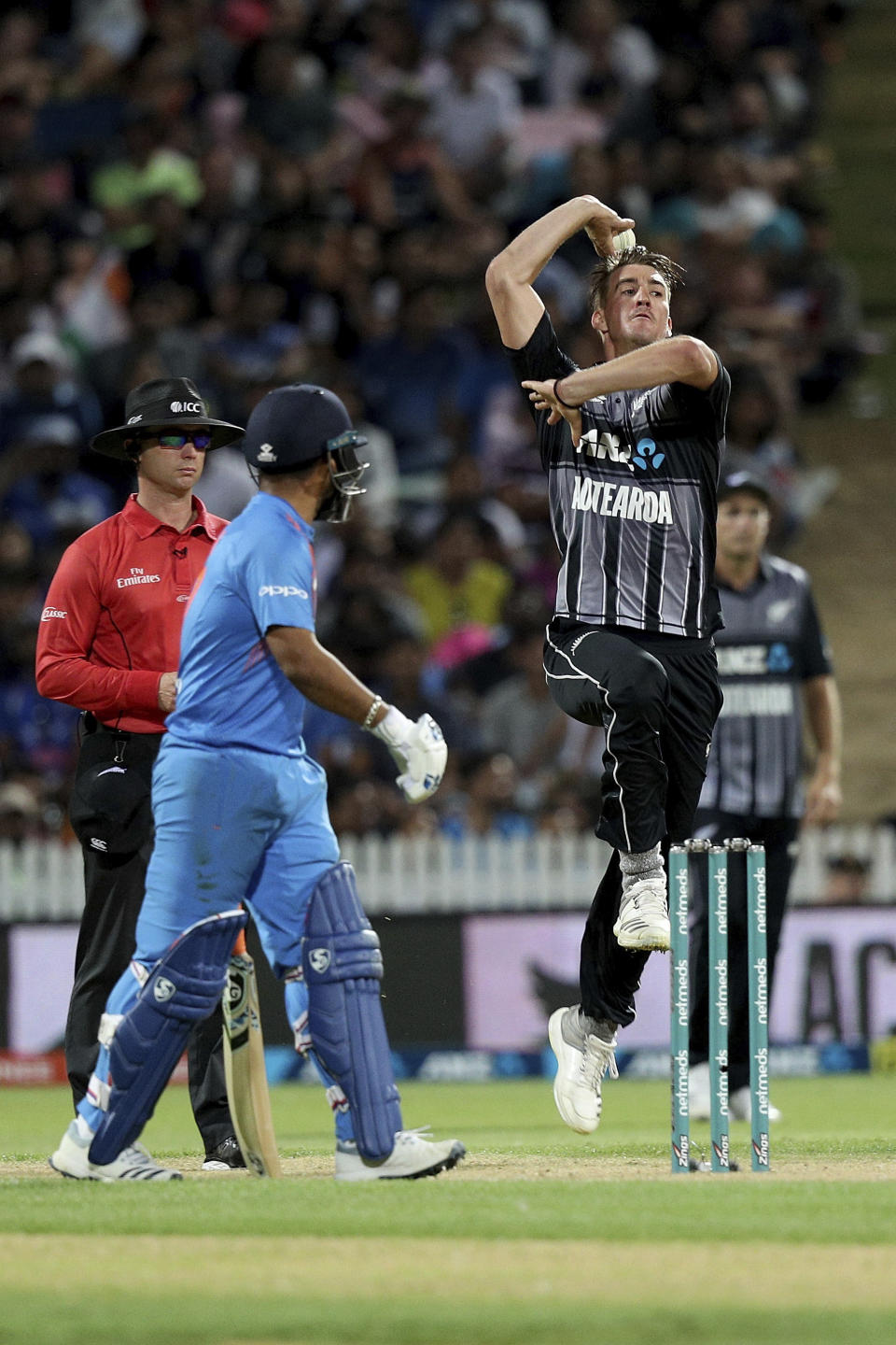 New Zealand's Blair Tickner bowls during their twenty/20 cricket international against India at Seddon Park in Auckland, New Zealand, Sunday, Feb. 10, 2019. (AP Photo/David Rowland)